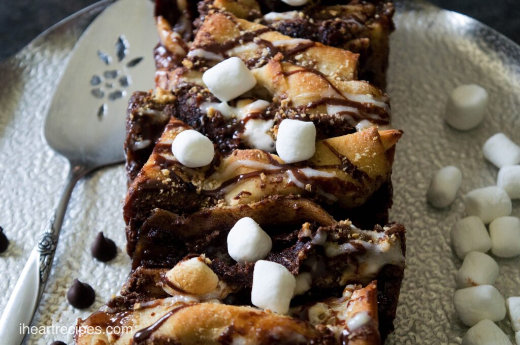 A loaf of gooey chocolate s'mores pull-apart bread, filled with chocolate hazelnut spread, sweet icing, and mini marshmallows.