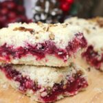 Homemade cranberry pecan bars, filled with tart cranberries and topped with a crumbly, crunchy pecan topping