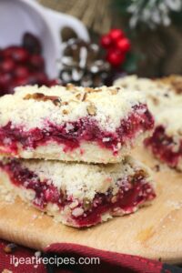 Homemade cranberry pecan bars, filled with tart cranberries and topped with a crumbly, crunchy pecan topping