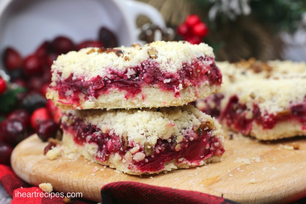 Delicious cranberry pecan bars are made with a shortbread base, sweet and tart cranberries, and a crunchy pecan topping. Perfect for a Holiday treat!