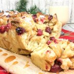 Eggnog bread pudding with cranberries and a homemade warm whiskey sauce