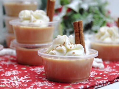 Eggnog jello shots with whipped cream and cinnamon.