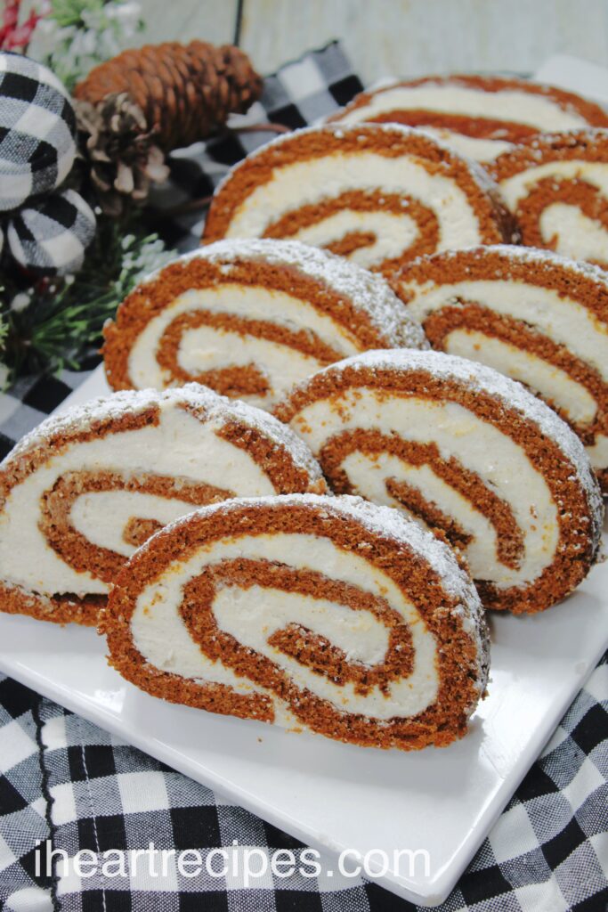 Slices of homemade gingerbread Swiss roll cake filled with a homemade maple buttercream.