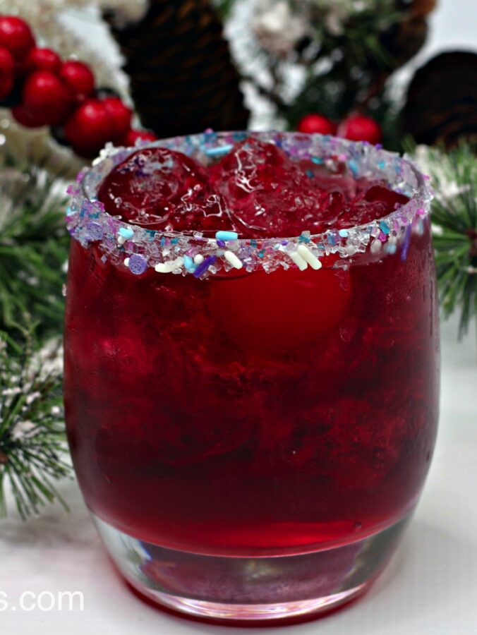 A Christmas cocktail made with gin, vodka, fruit punch, and Sprite.