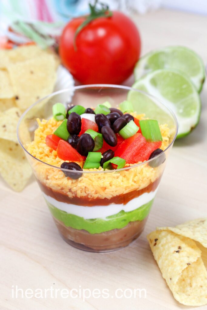 These delicious nacho layer dip cups are best served with tortilla chips for quick and easy appetizer.