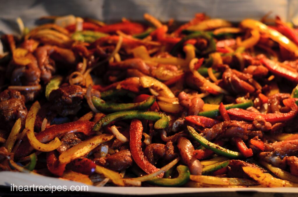 Sheet Pan Chicken Fajitas baking in the oven.