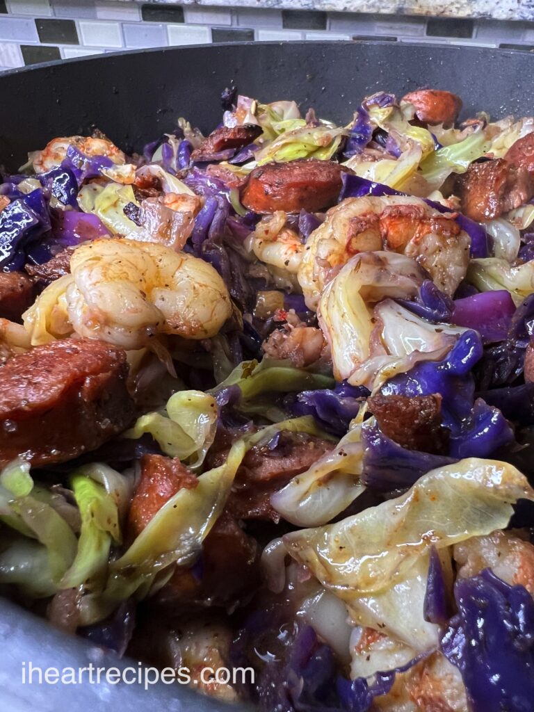 Tender Cajun fried cabbage cooked with shrimp, andouille sausage, and zesty seasonings. 