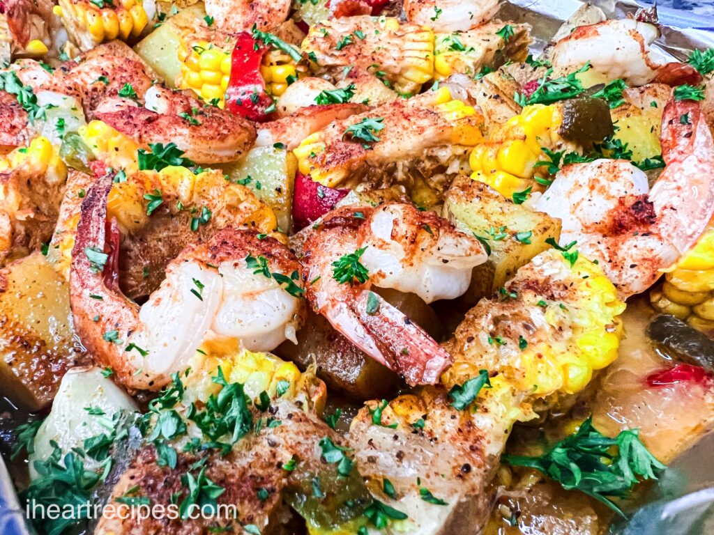 A delicious sheet pan seafood boil made with shrimp, potatoes, corn, and zesty seasonings.