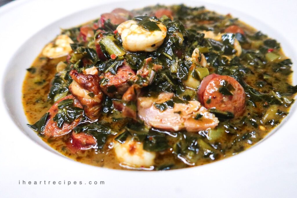 A bowlful of Gumbo Greens. Tender sausage, sweet shrimp and smoked turkey give this dish real depth. 