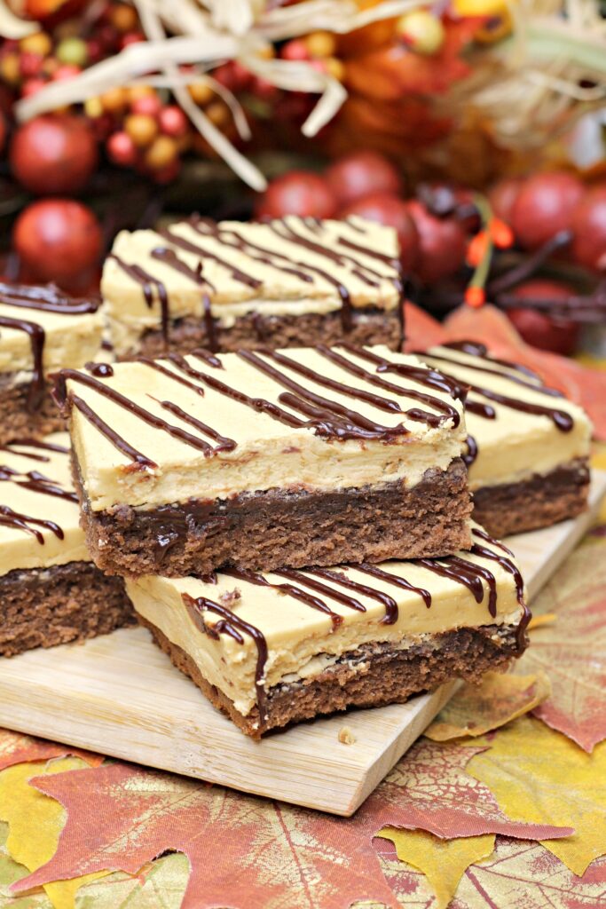Layers of varying shades and densities of chocolate are displayed in this closeup image of stacked gooey mocha brownies. 