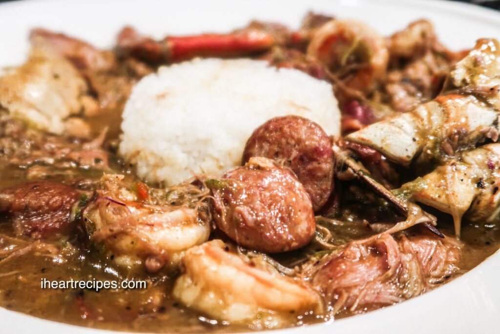 Tender meat, warm broth and white rice fill a white bowl. 