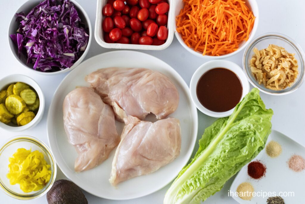 All of the ingredients for BBQ Chicken Salad divided into separate bowls. 