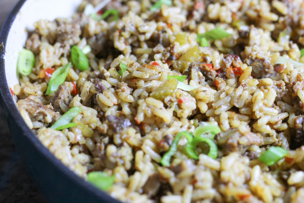 authentic dirty rice with red peppers, and meat.