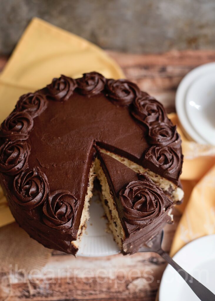 two layered moist yellow cake recipe with chocolate icing and a moist texture