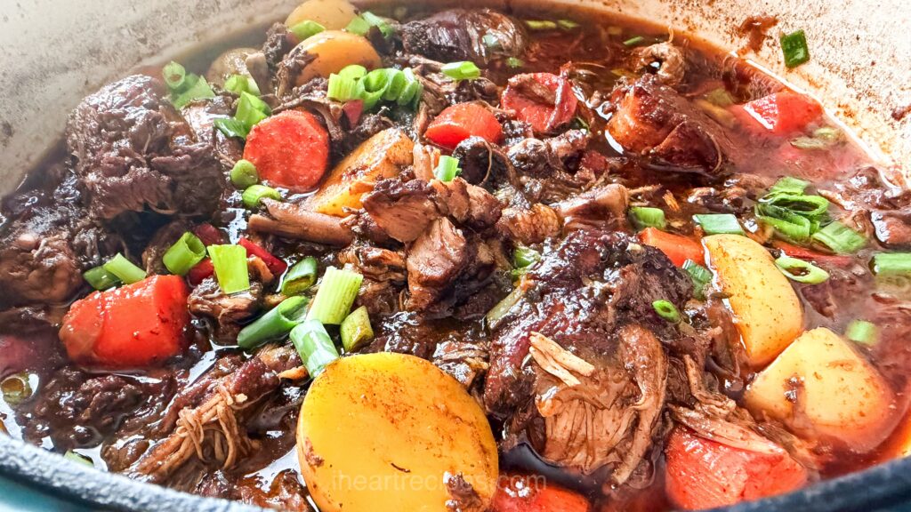 chicken, carrots, and potaoes topped with green onions.